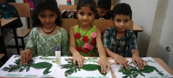 Busy hands printing leaves in class