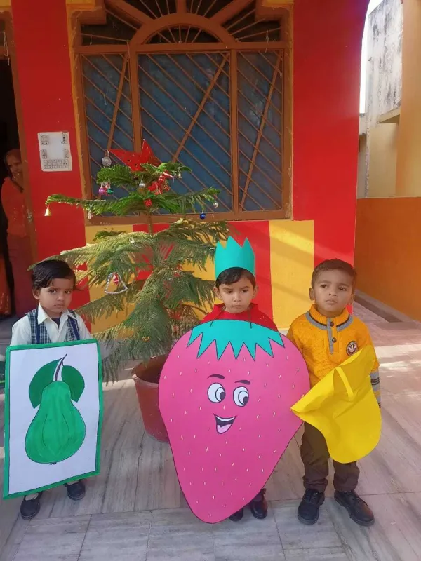 Fruit friends: a pear, a strawberry and a mango