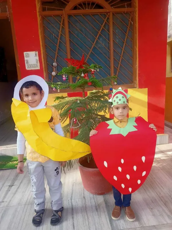 A banana and a strawberry pose together